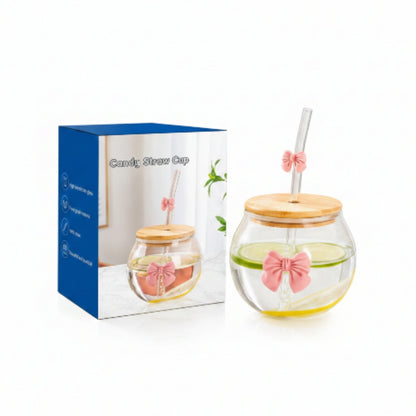 Glass Round Cup With Bow And Straw On White Background